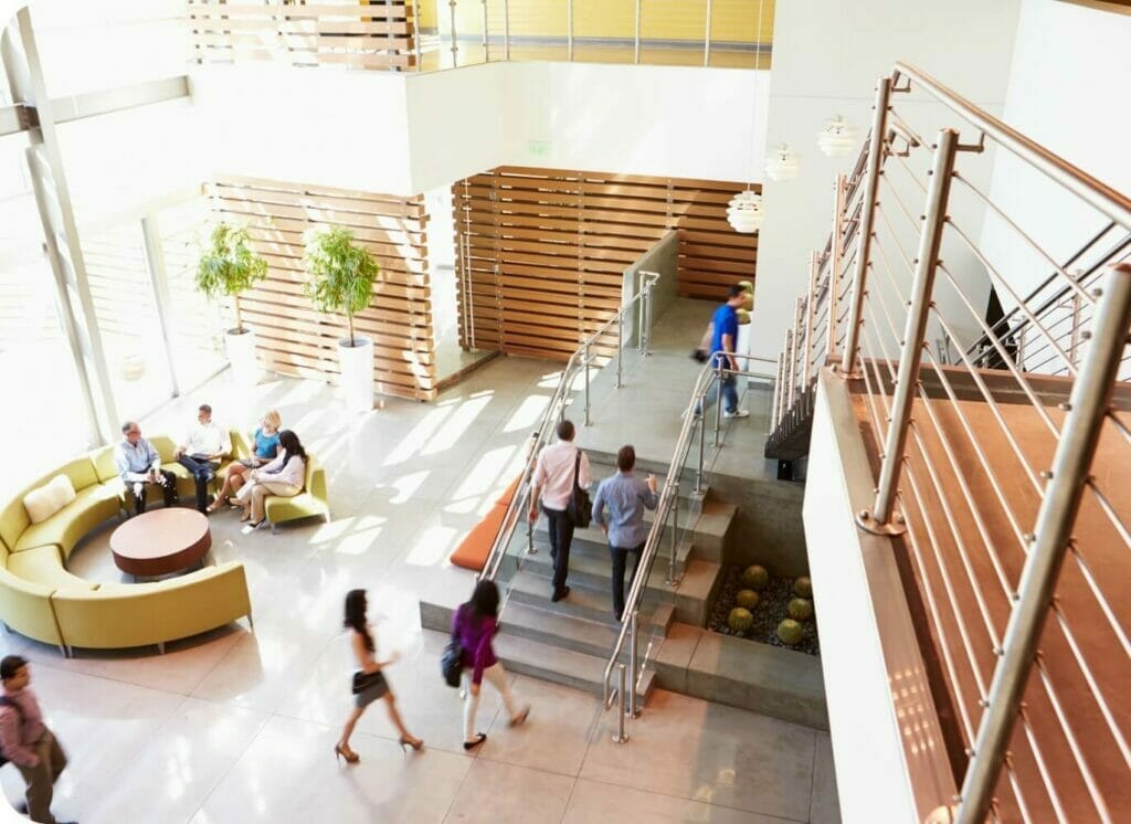 People walking up the stairs in a building