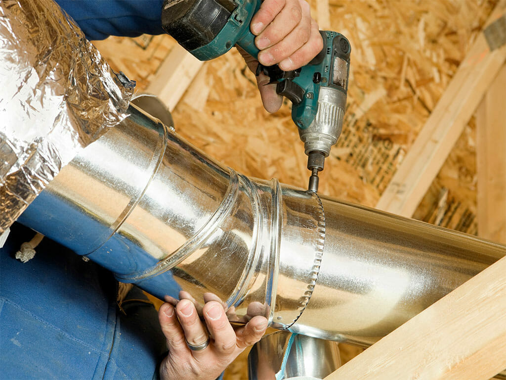 man repairing a dryer vent